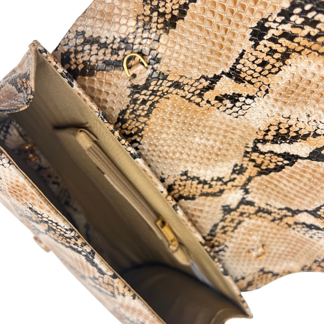 KD Embossed Hand Clutch
